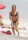 Erika Mader wearing black bikini on the beach at Arpoador, Rio de Janeiro